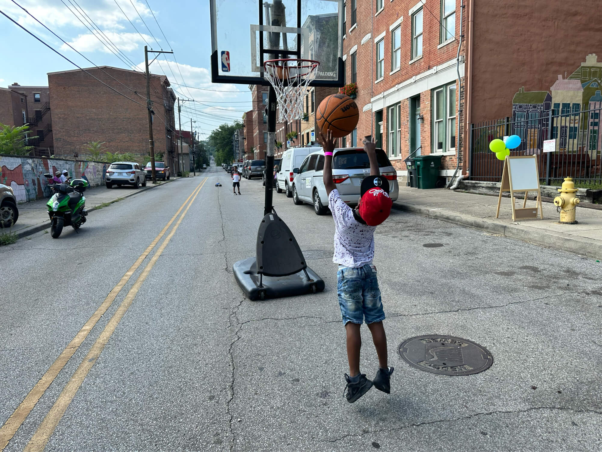 playing-basketball (1) child playing basketball in the street