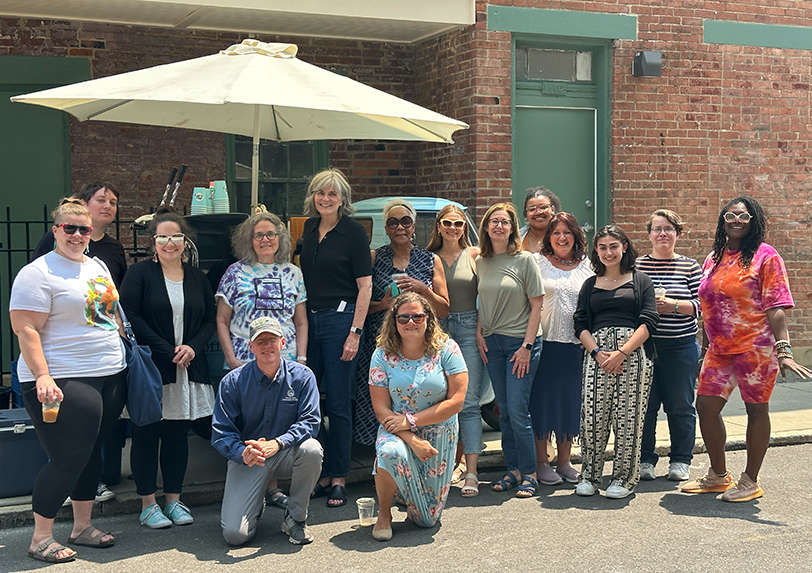 group staff photo outside at an event