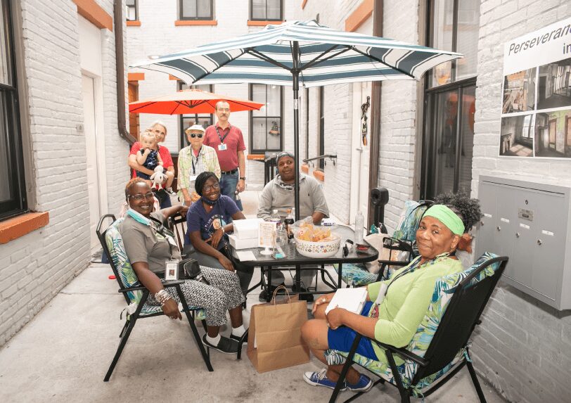 Group sitting at a table outside